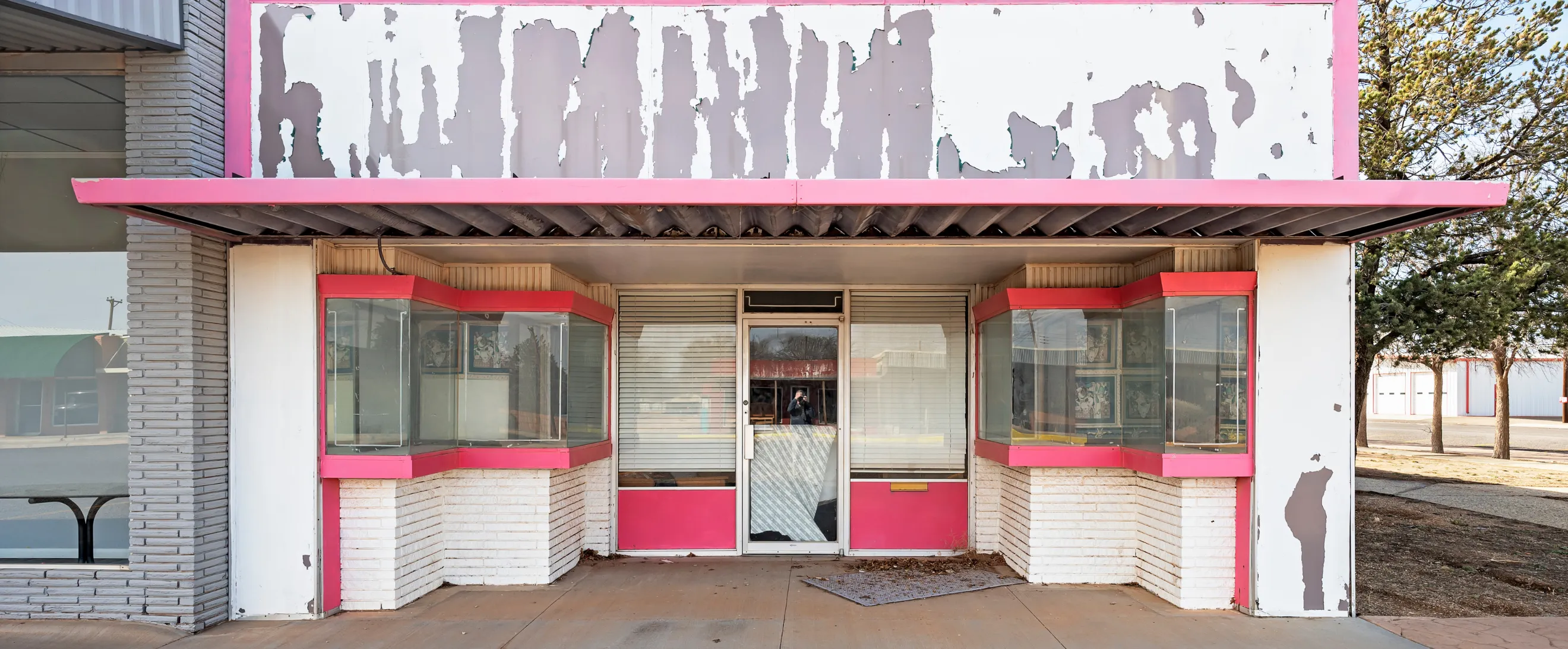 Old commercial storefront before remodeling project in Los Angeles with worn facade