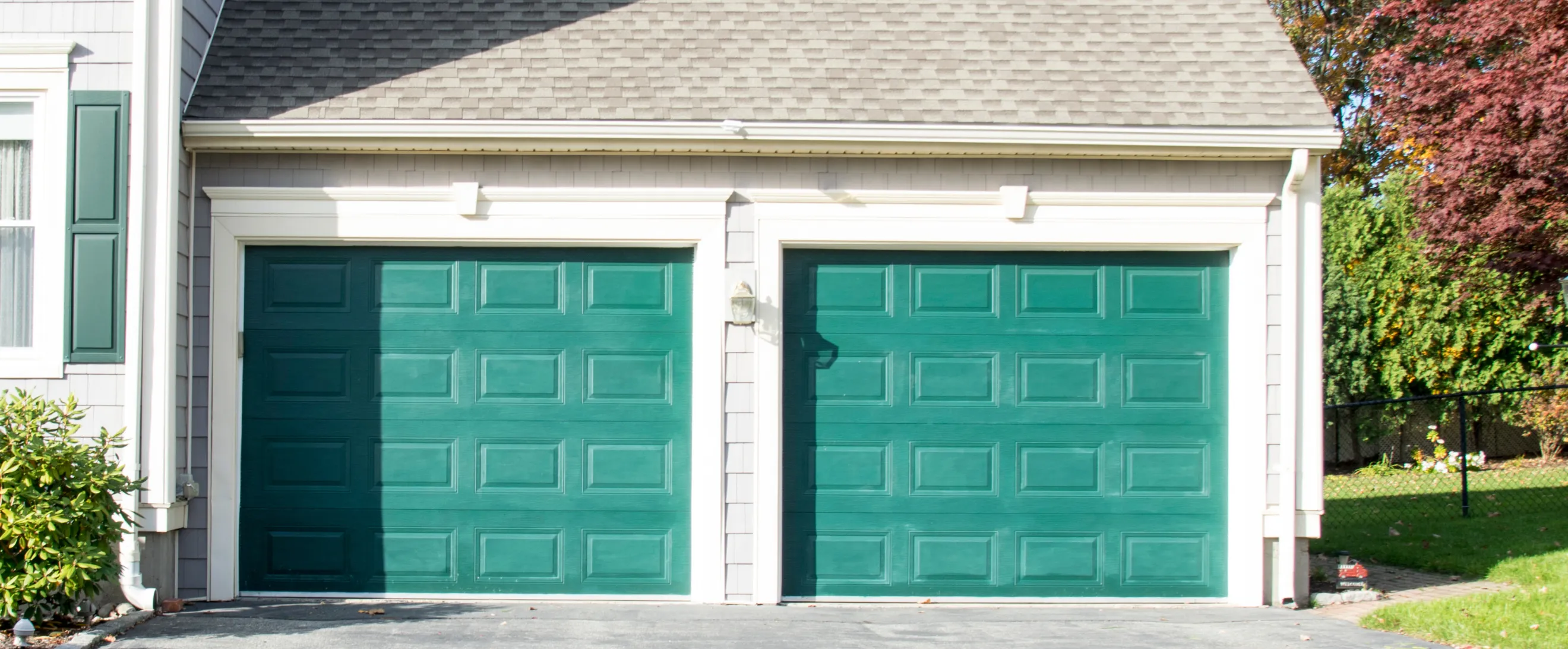 Old garage before ADU conversion in Los Angeles with original garage doors and outdated exterior layout