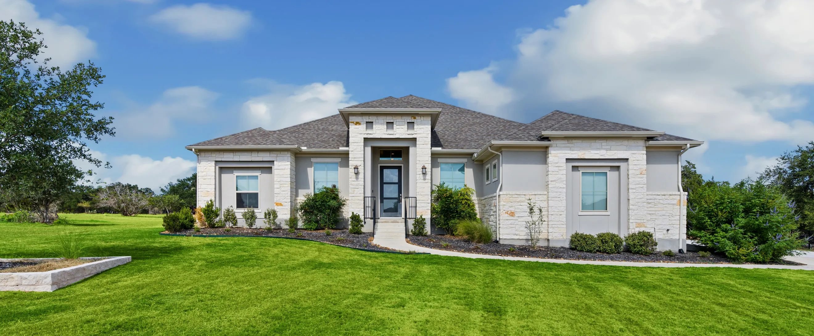 Completed custom home construction in Los Angeles featuring modern luxury design and landscaped front yard